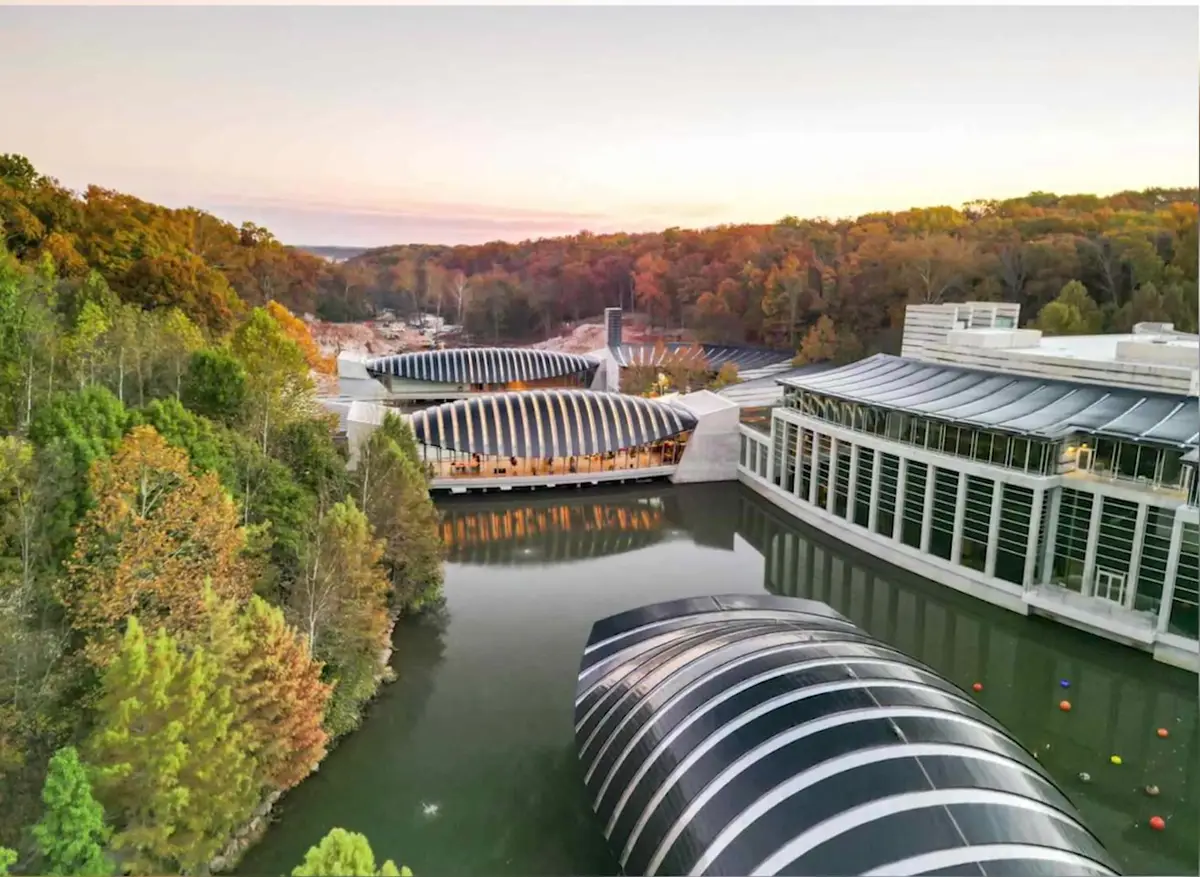 Aerial view of Crystal Bridges Museum of American Art in Bentonville, Arkansas, with autumn colour across the surrounding Ozark ravine