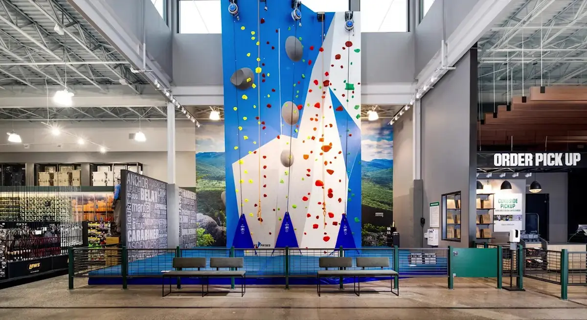 Interior of a Dick's House of Sport store showing the climbing wall and order pickup counter, the format coming to Concord Commons in Lowell, Arkansas