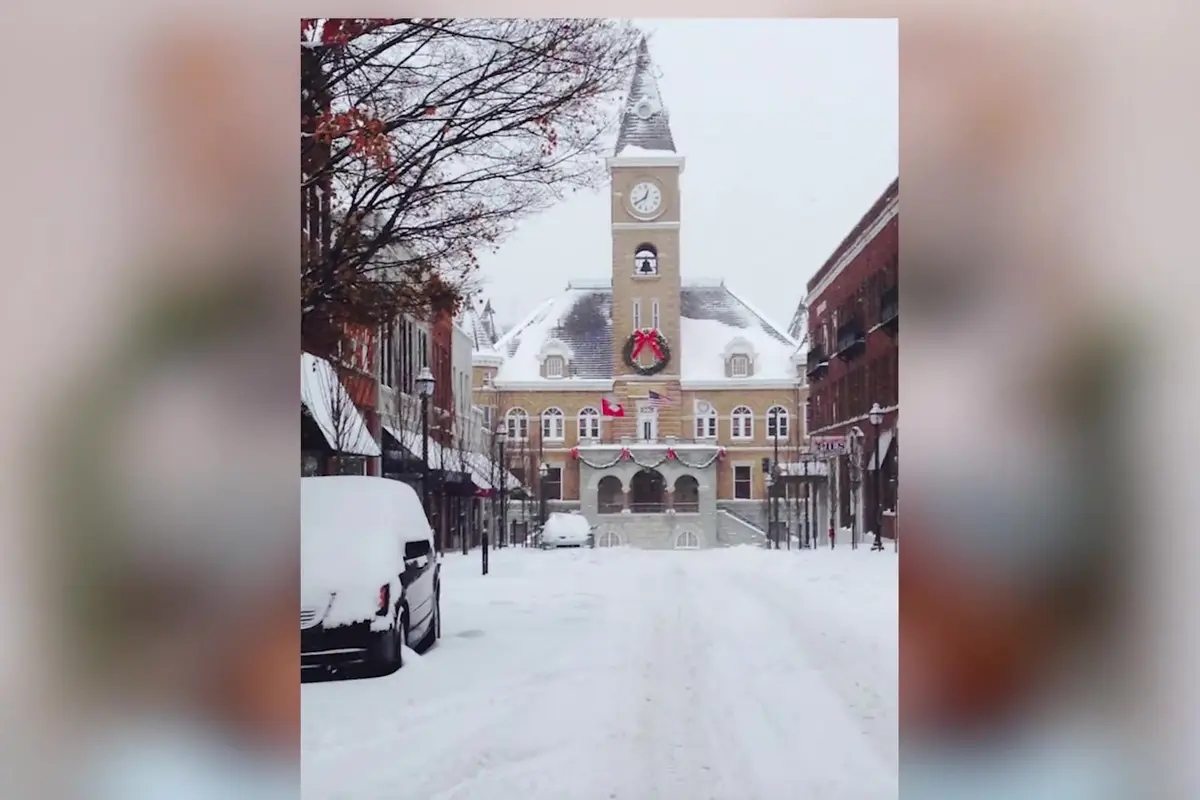 Snow-covered street on the Fayetteville square with the historic clock tower during a Northwest Arkansas winter storm