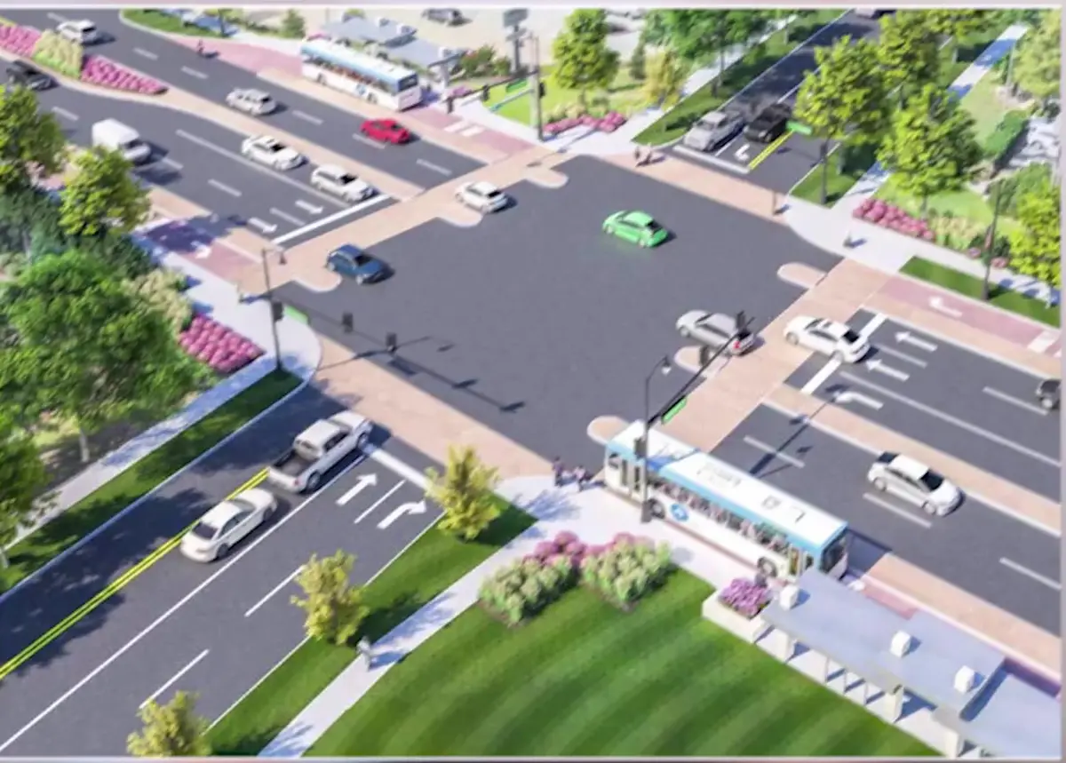 Rendering of a redesigned Northwest Arkansas arterial intersection with bus stops, bike lanes and landscaped medians