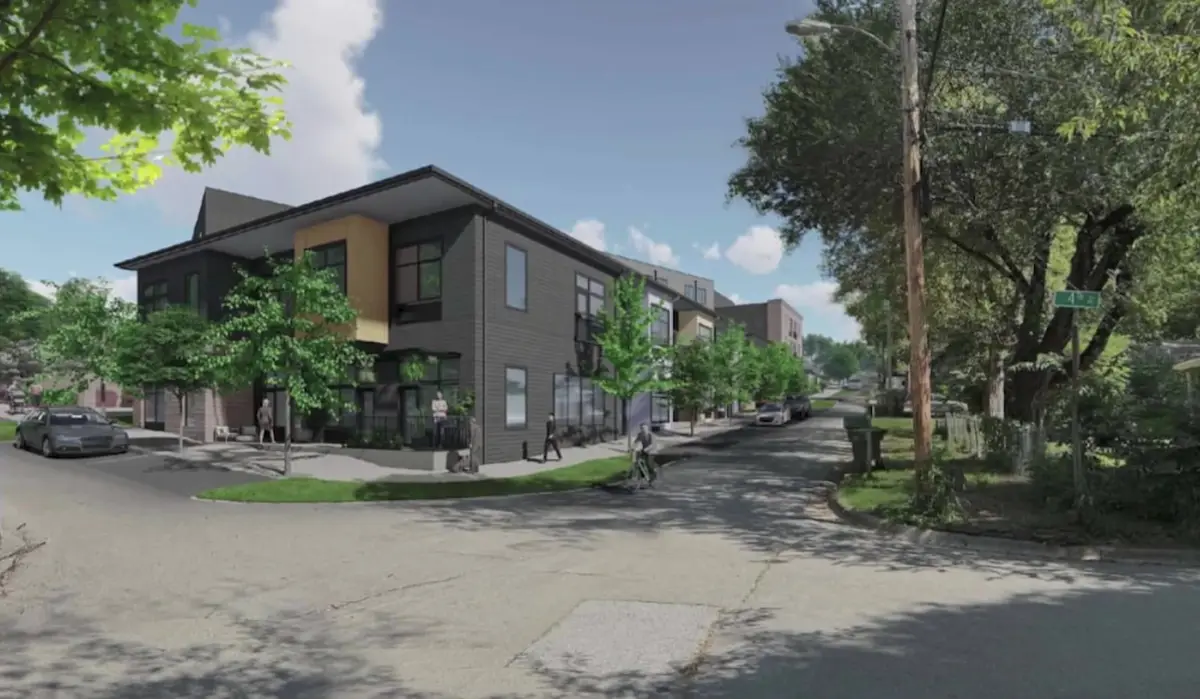 Rendering of a three-story infill townhome and apartment development on a tree-lined Northwest Arkansas street corner