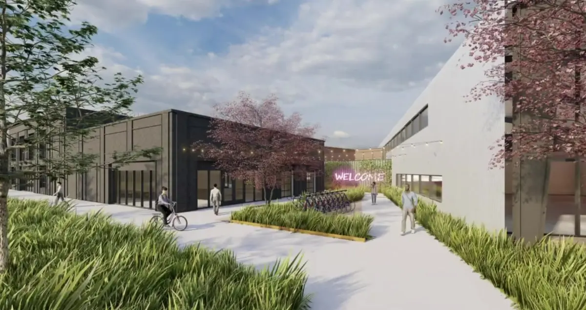 Rendering of a walkable mixed-use downtown district with shops, bike parking and landscaped paths in Tontitown, Arkansas