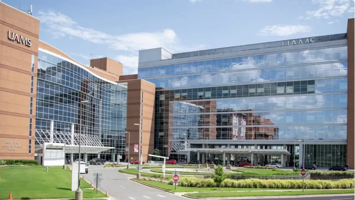Exterior of the University of Arkansas for Medical Sciences hospital campus with glass and brick towers