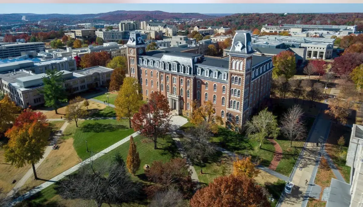 Aerial view of Old Main and the University of Arkansas campus in Fayetteville surrounded by autumn colour