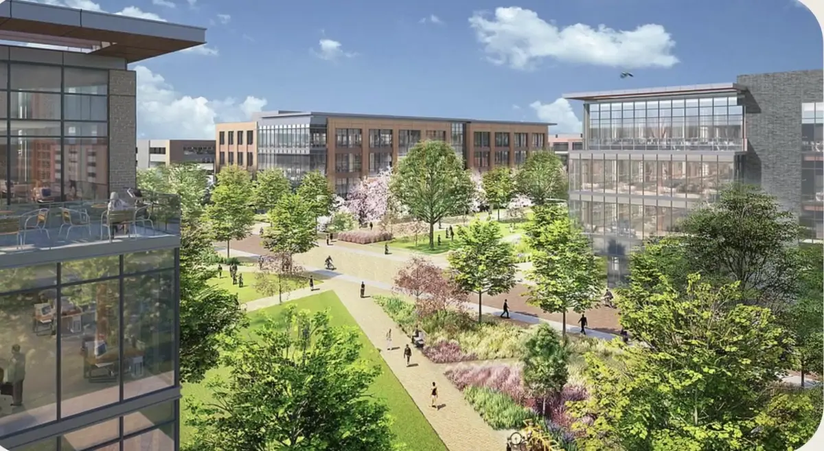 Rendering of the Walmart home office campus in Bentonville with glass office buildings, walking paths and landscaped green space