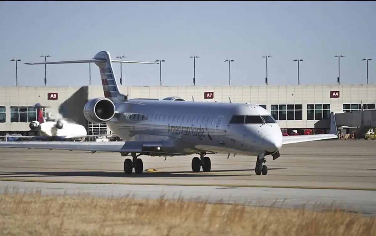 American Eagle regional jet taxiing past the terminal gates at Northwest Arkansas National Airport, XNA