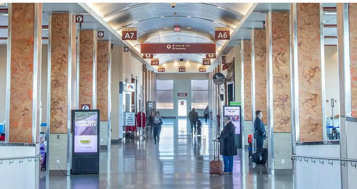 Travelers in the gate concourse at XNA, Northwest Arkansas National Airport, which set record enplanements in 2026